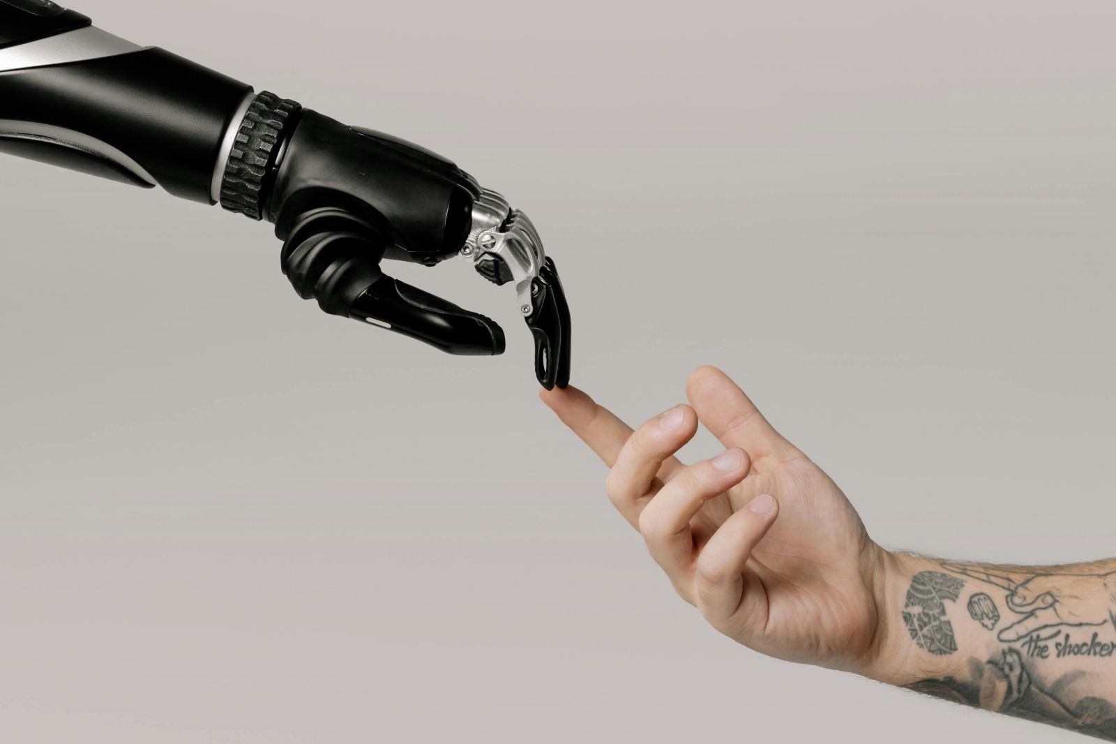 robot arm touching human arm threshold marketing blog ai and machine learning