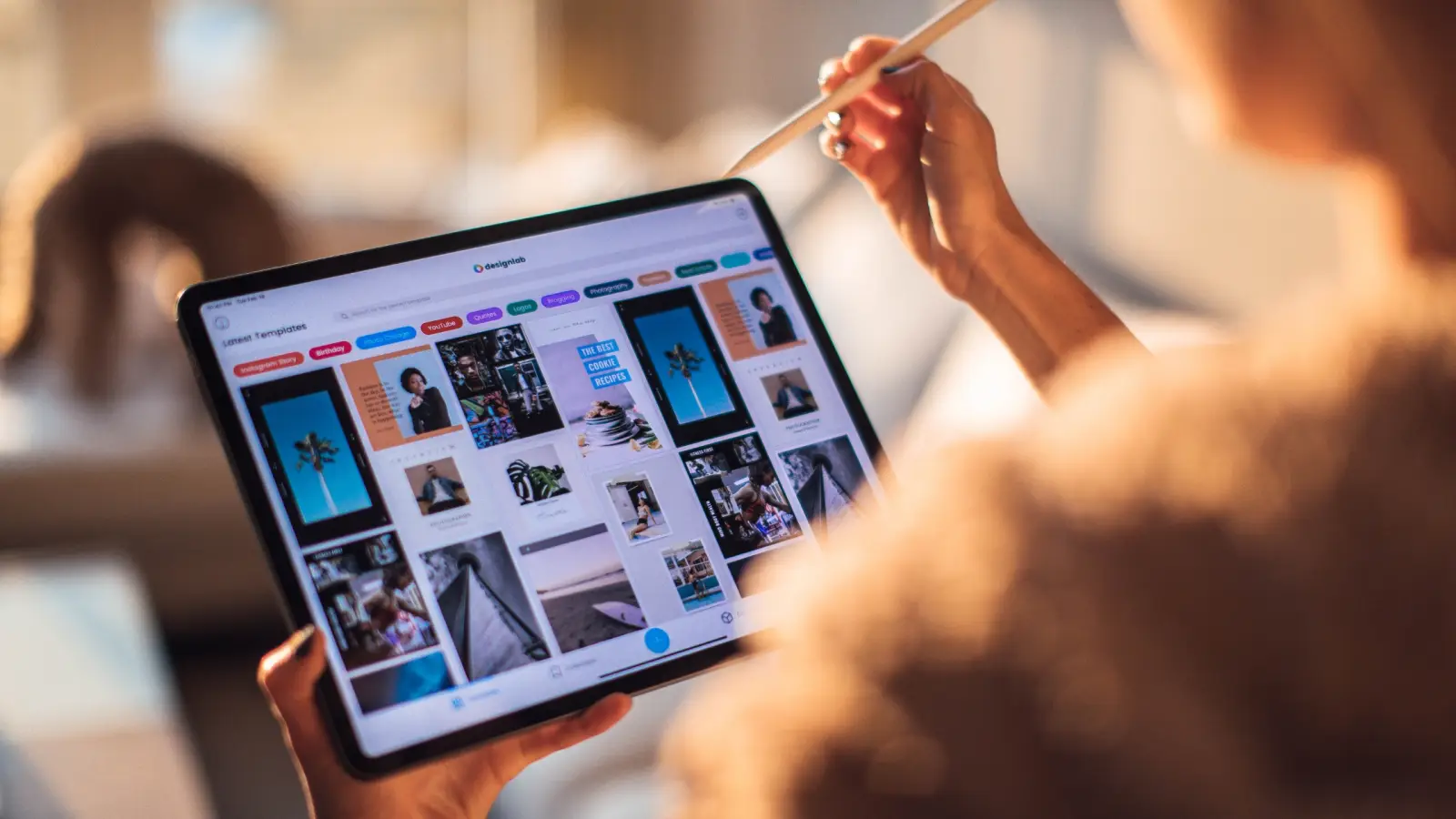 someone scrolling through marketing assets on their ipad